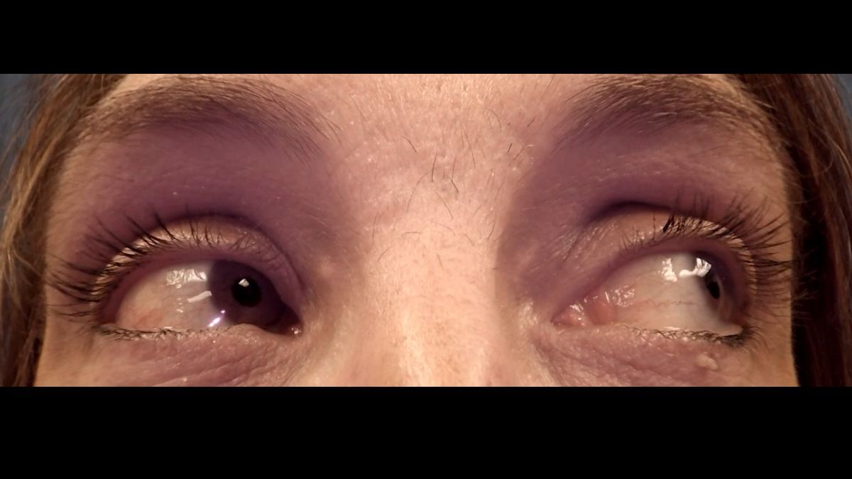 Horizontal Gaze Nystagmus (HGN) eye test demonstration showing officer administering field sobriety test